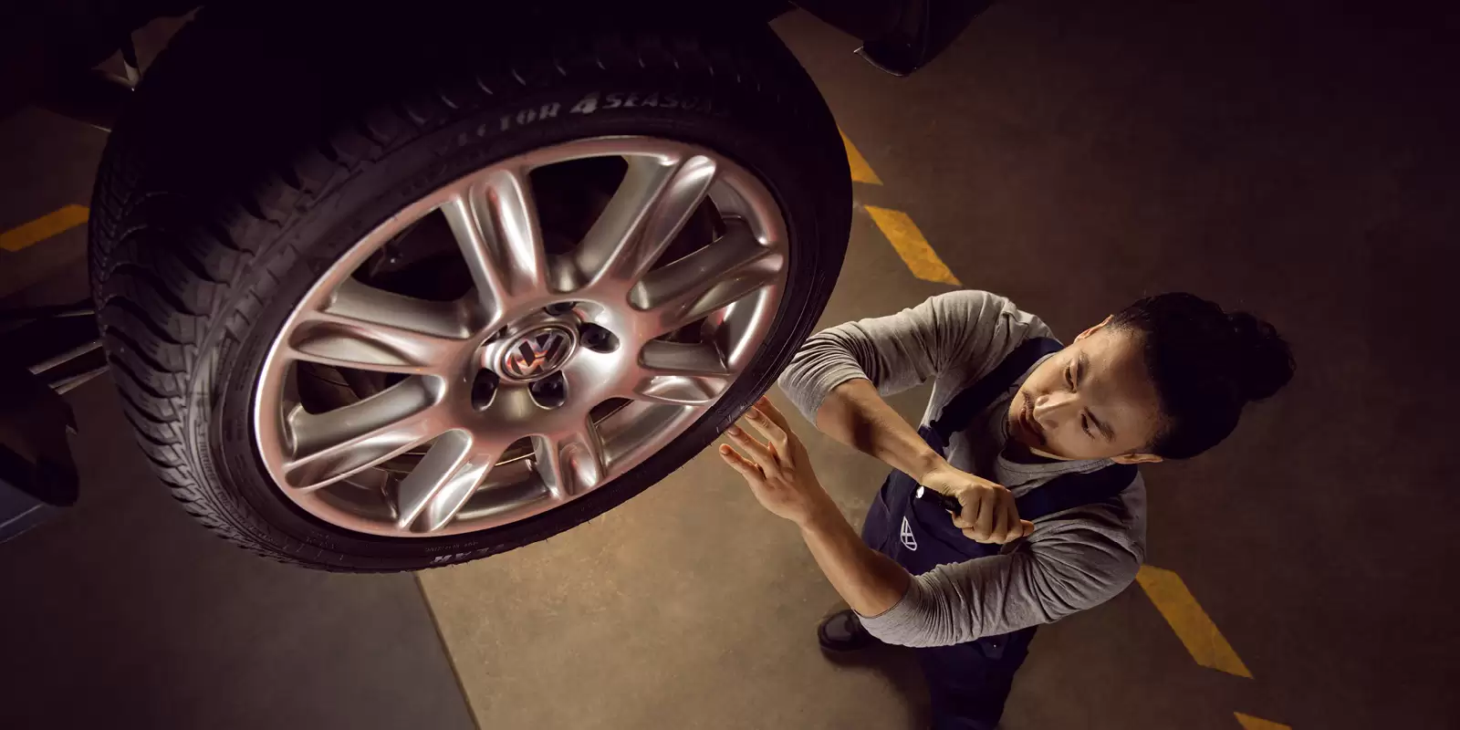 Mechanic looking at a wheel